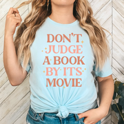 Don't Judge a Book By Its Movie Unisex T-shirt